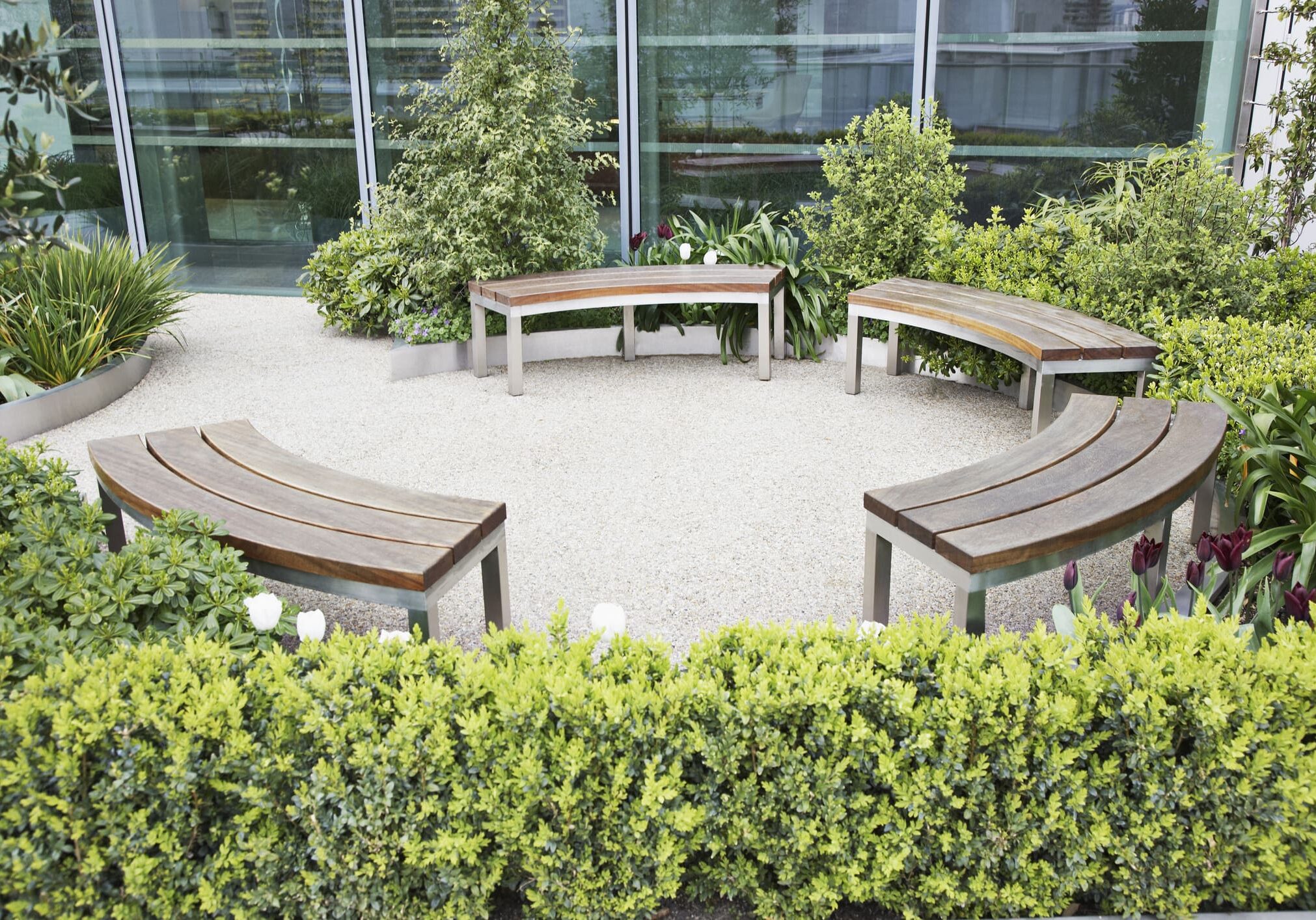 Circular benches in a garden setting.